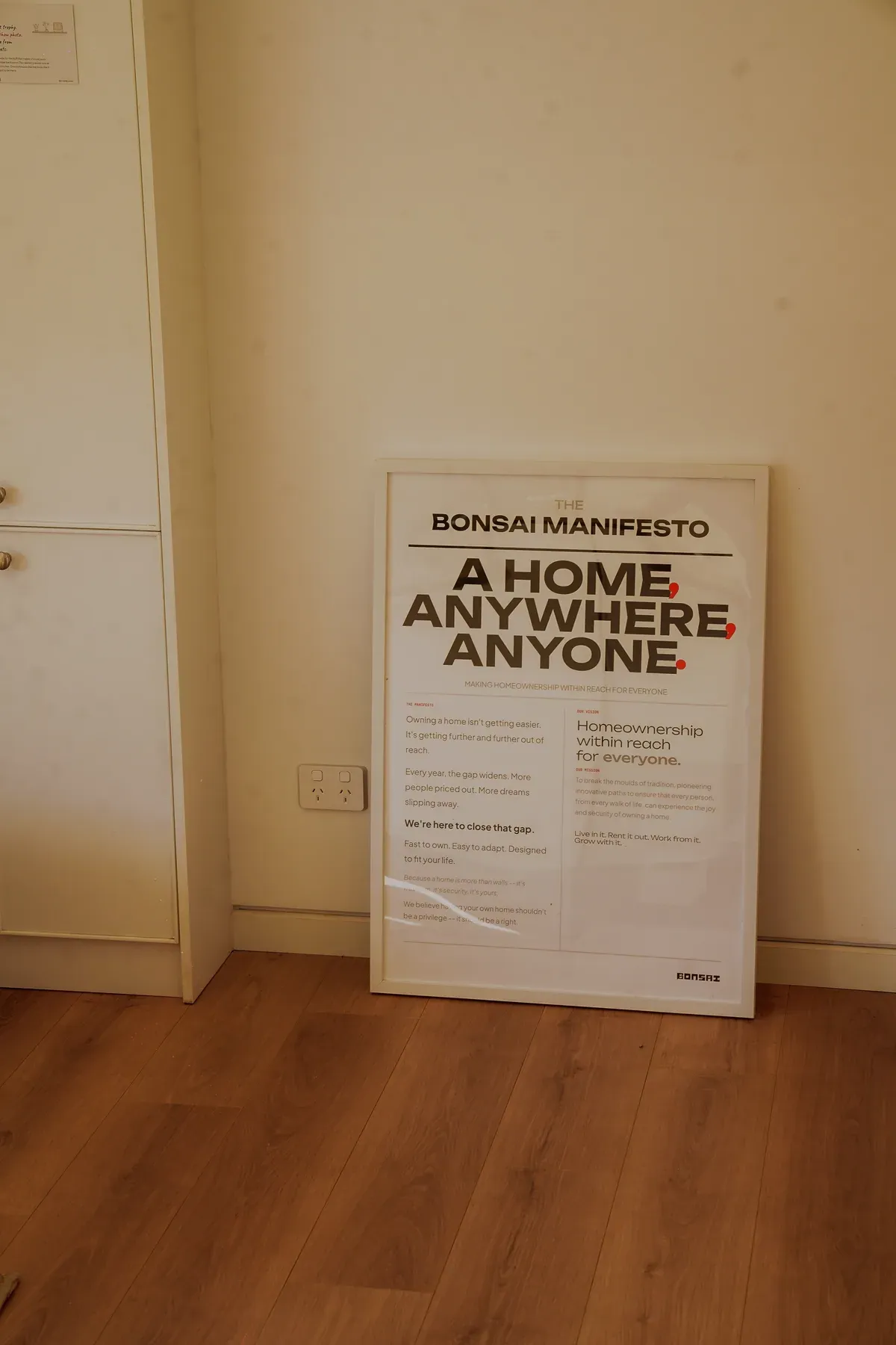 A framed Bonsai manifesto inside the display home.