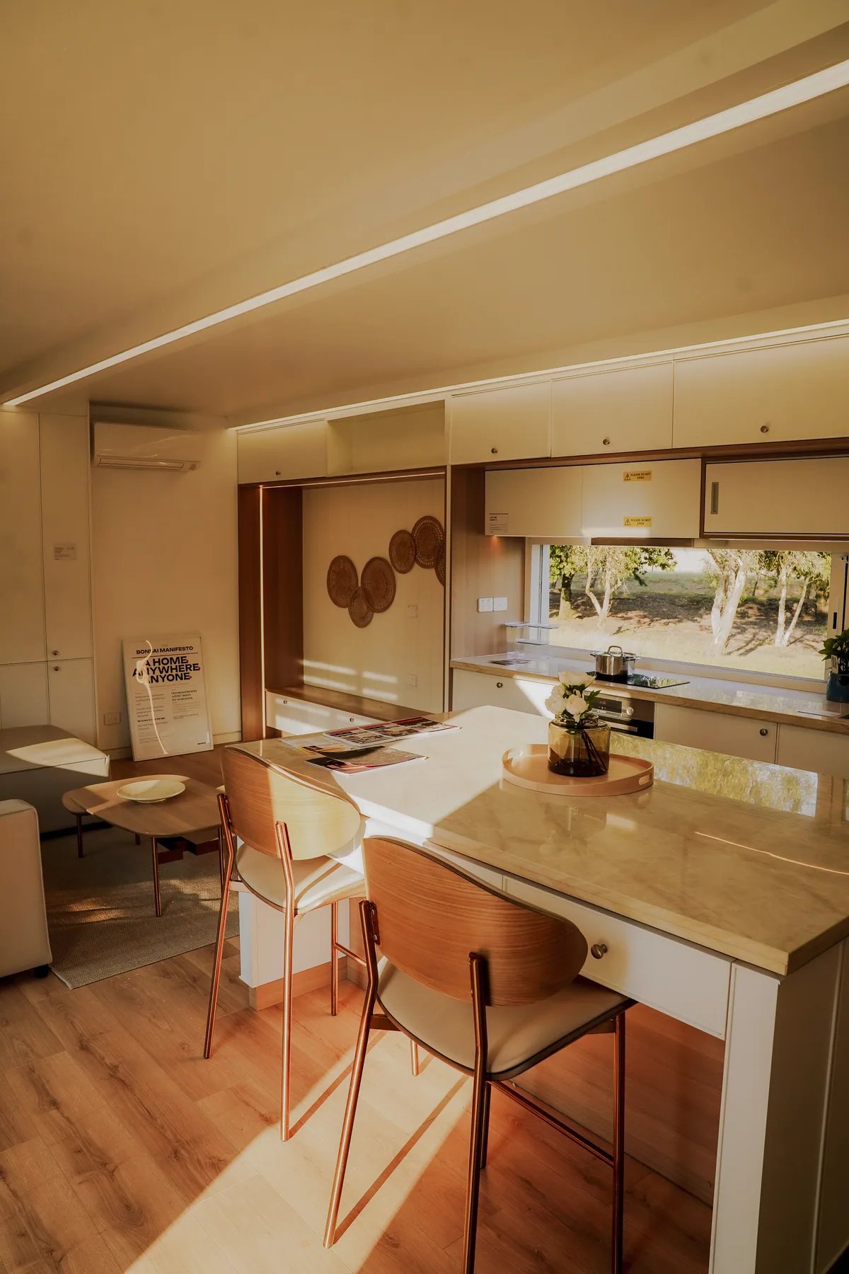 Sunlight across the kitchen and living area of the display home.