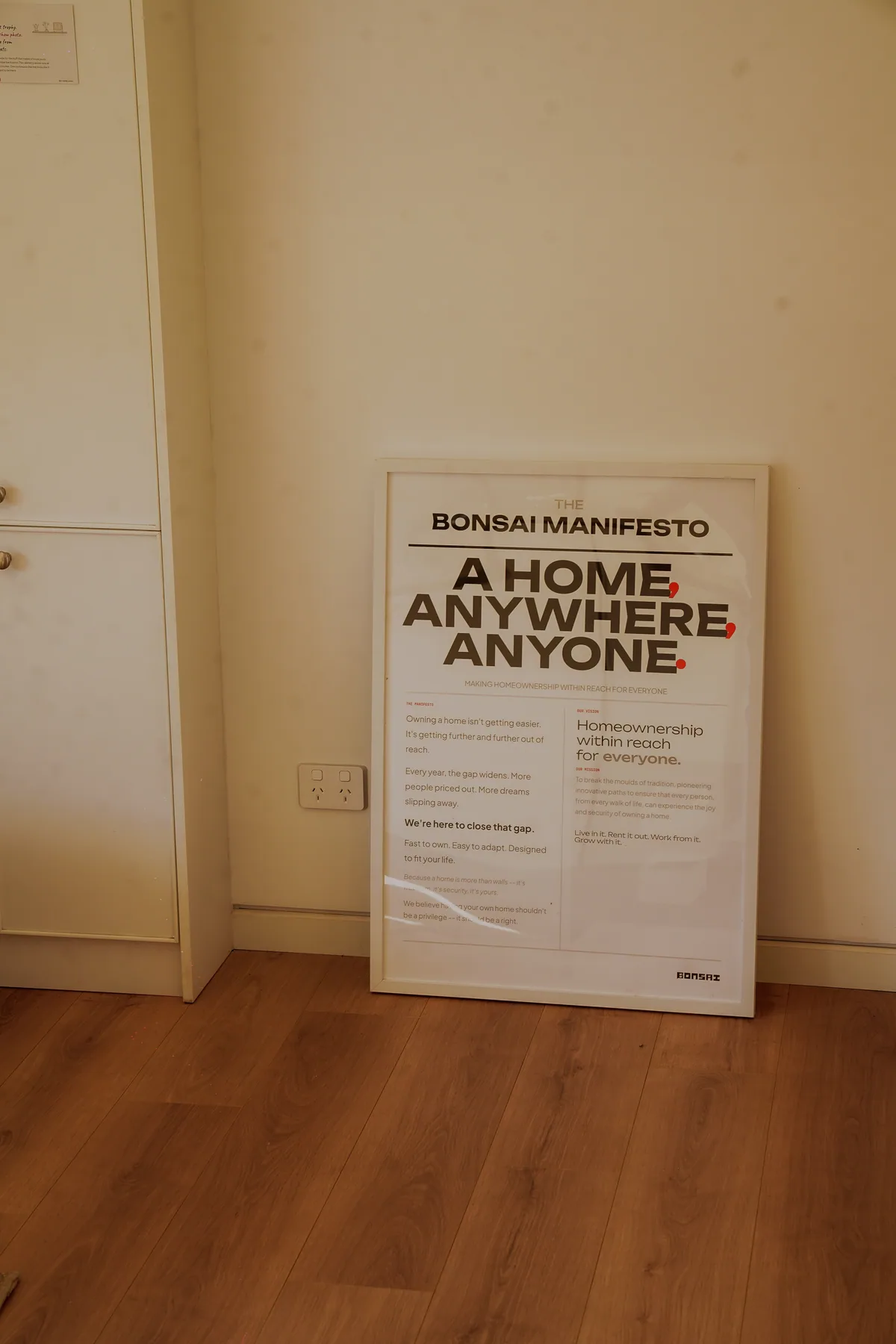 A framed Bonsai manifesto inside the display home.