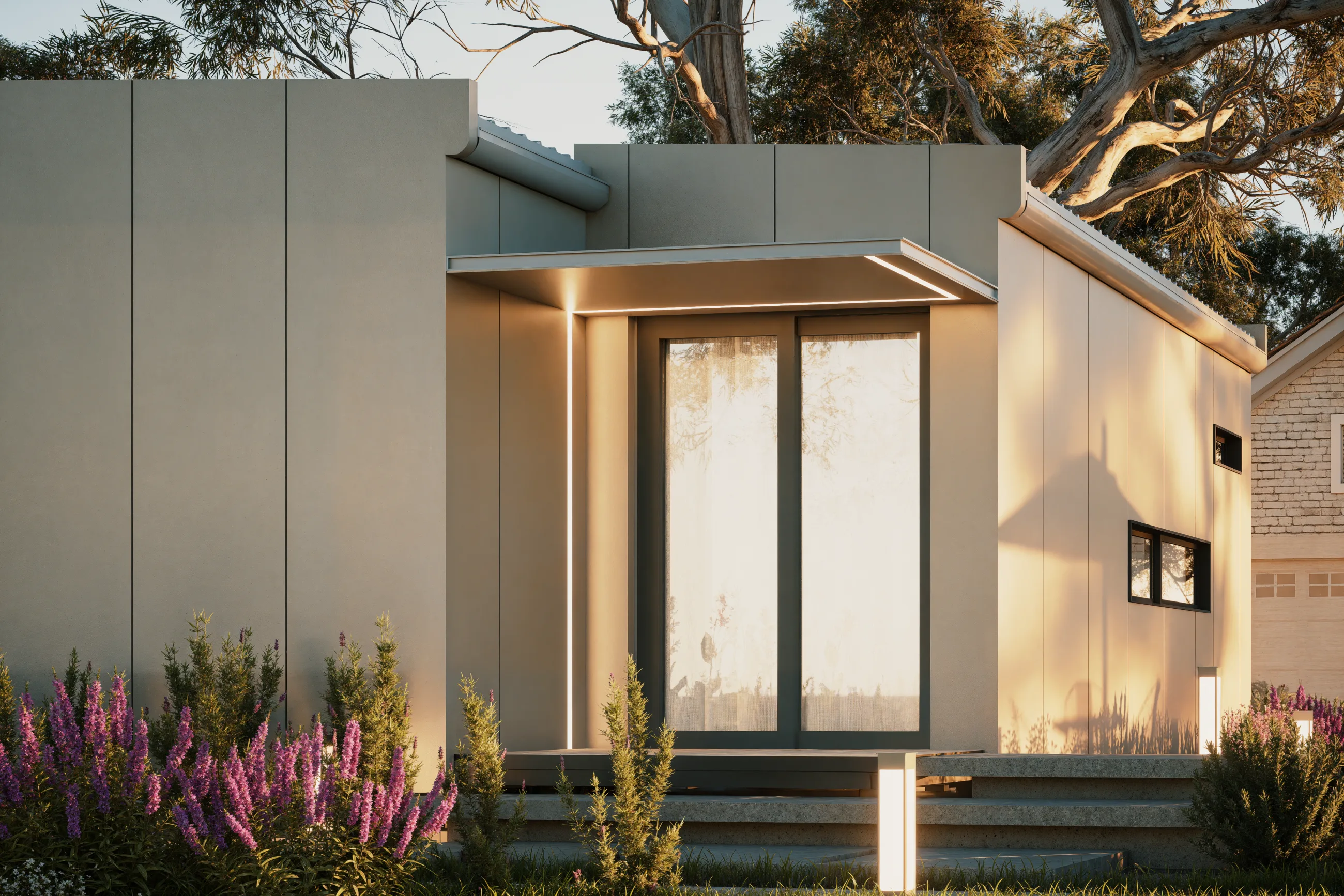 The Studio entry, lit under its canopy at dusk