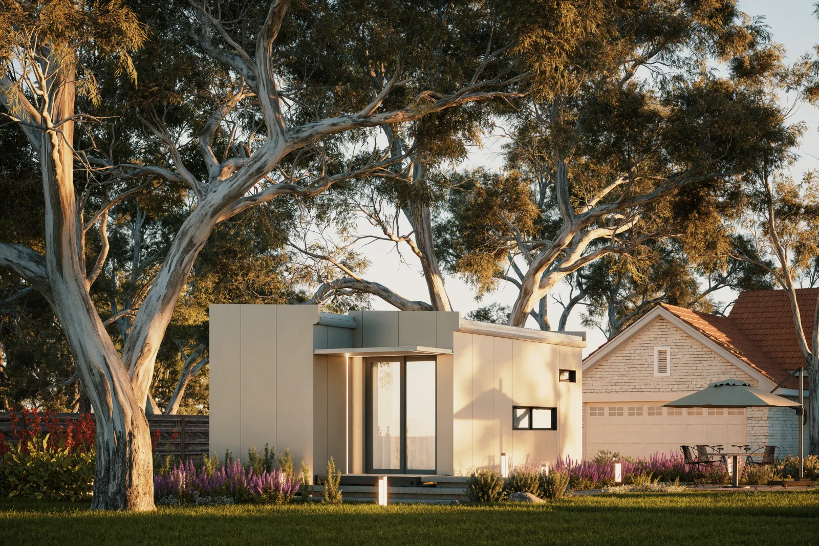 The Studio at the end of a lawn under tall gum trees